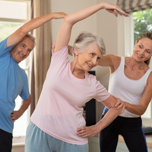 Elderly people stretching in class